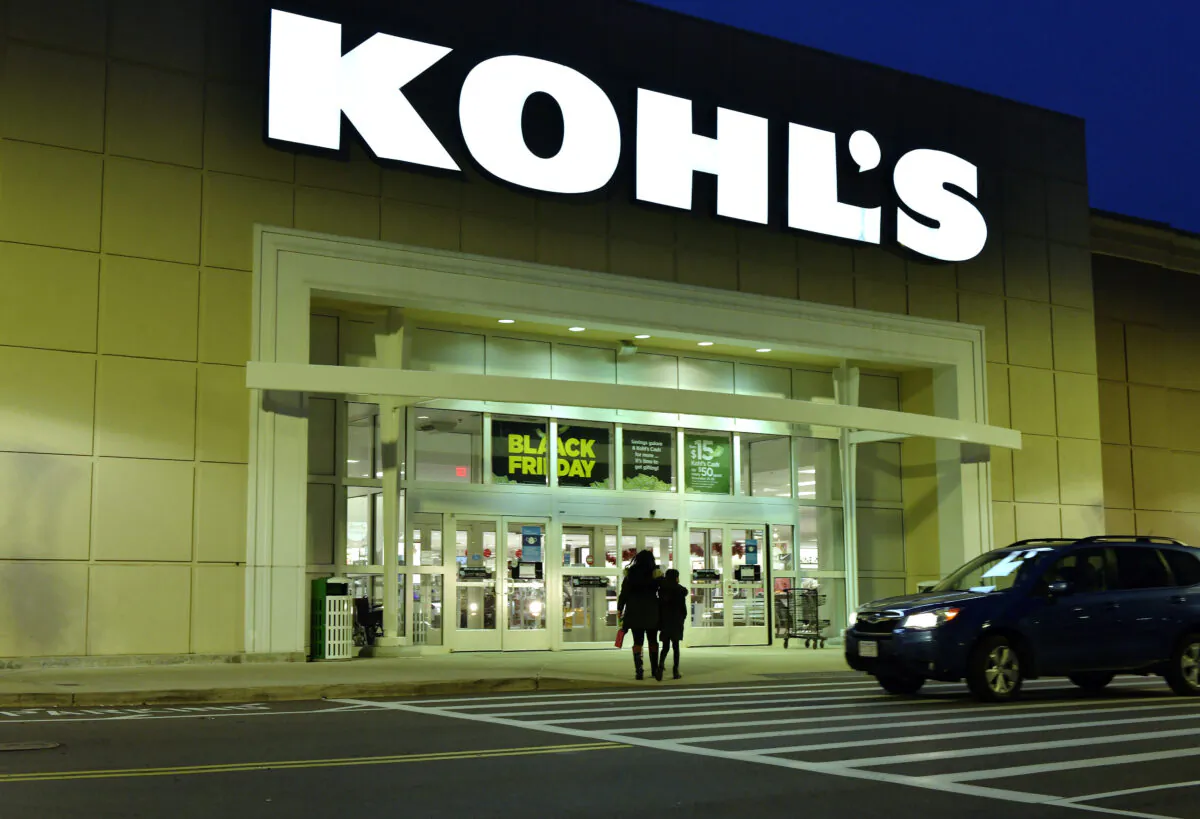 A pair of shoppers arrive at a Kohl's in Everett, Mass., on Nov. 26, 2021. (Josh Reynolds/AP Photo)
