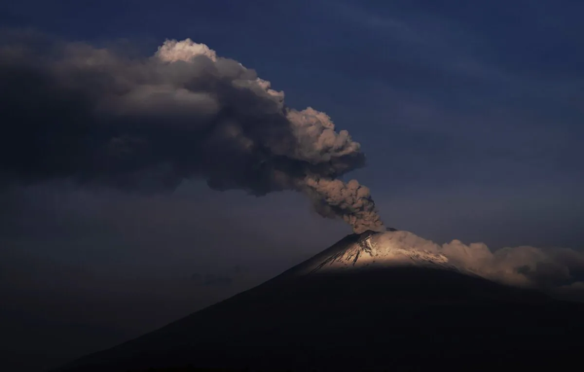 The Popocatepetl volcano spews ash and steam, seen from Santiago Xalitzintla, Mexico, on May 24, 2023. (Marco Ugarte/AP Photo)