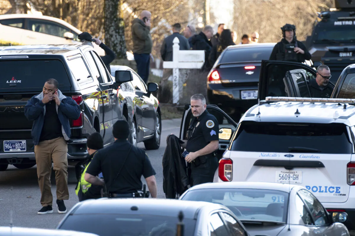 Nashville Police gather at the scene after a Metro Nashville Police officer shot and killed Grammy-winning sound engineer Mark Capps while at his home to arrest him on warrants in Nashville, Tenn., on Jan. 5, 2023. (Andrew Nelles/The Tennessean via AP)