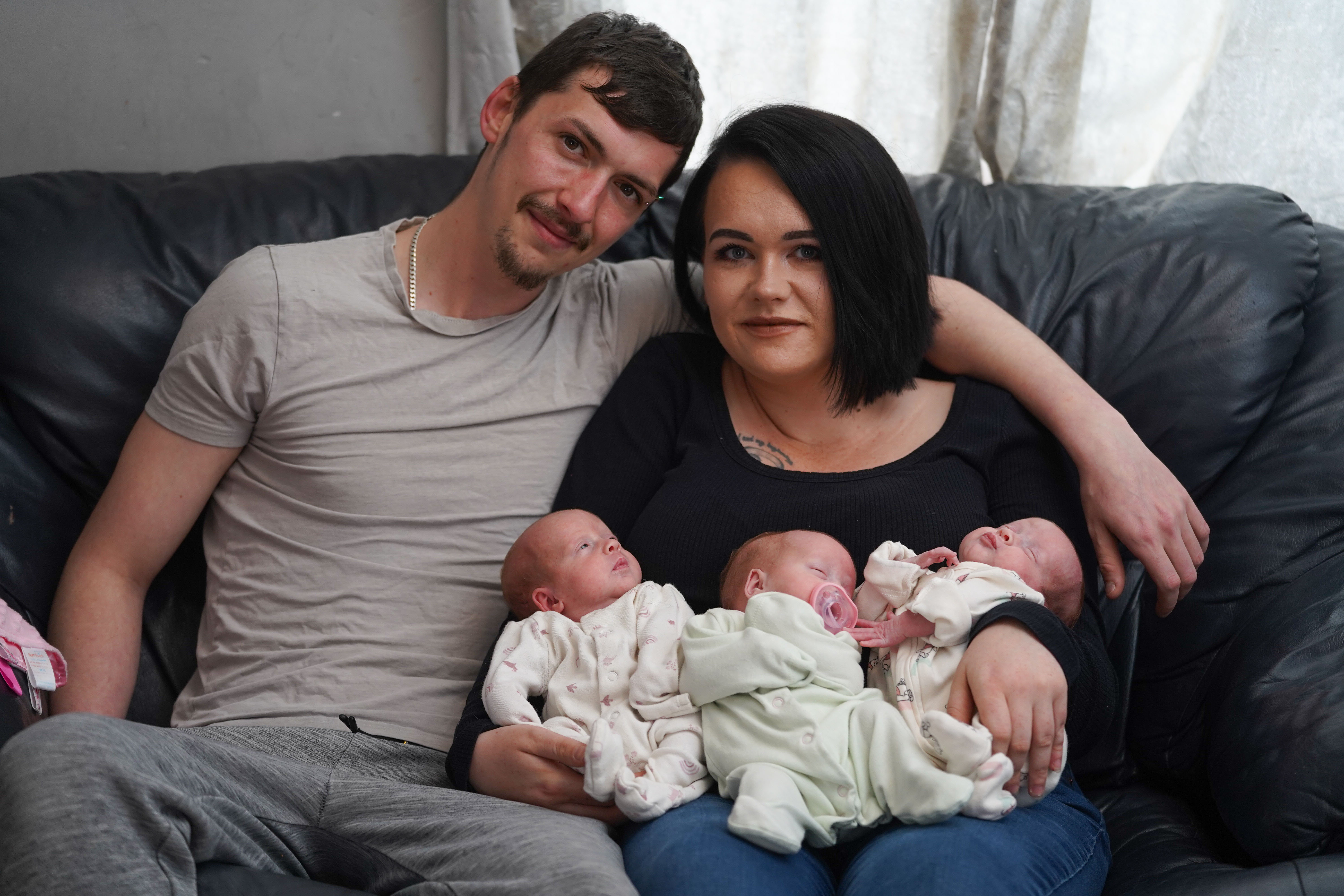 couple with their identical triplets