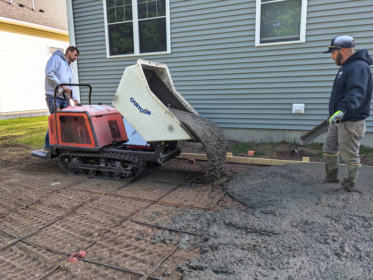 Years ago it would have taken eight men with wheelbarrows to bring the concrete to the rear of this house. You can rent this machine to transport and dump the concrete exactly where you need it. (Tim Carter/Tribune Content Agency)