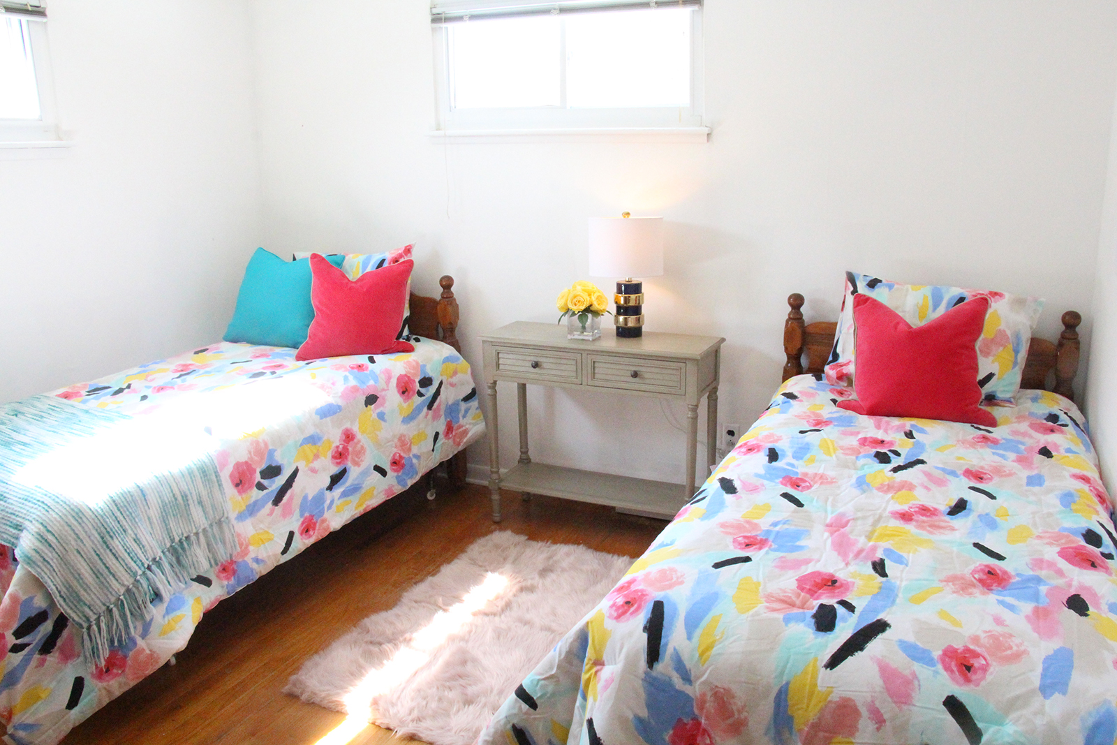 A children’s bedroom is invigorated by incorporating a new console and new bedding. 