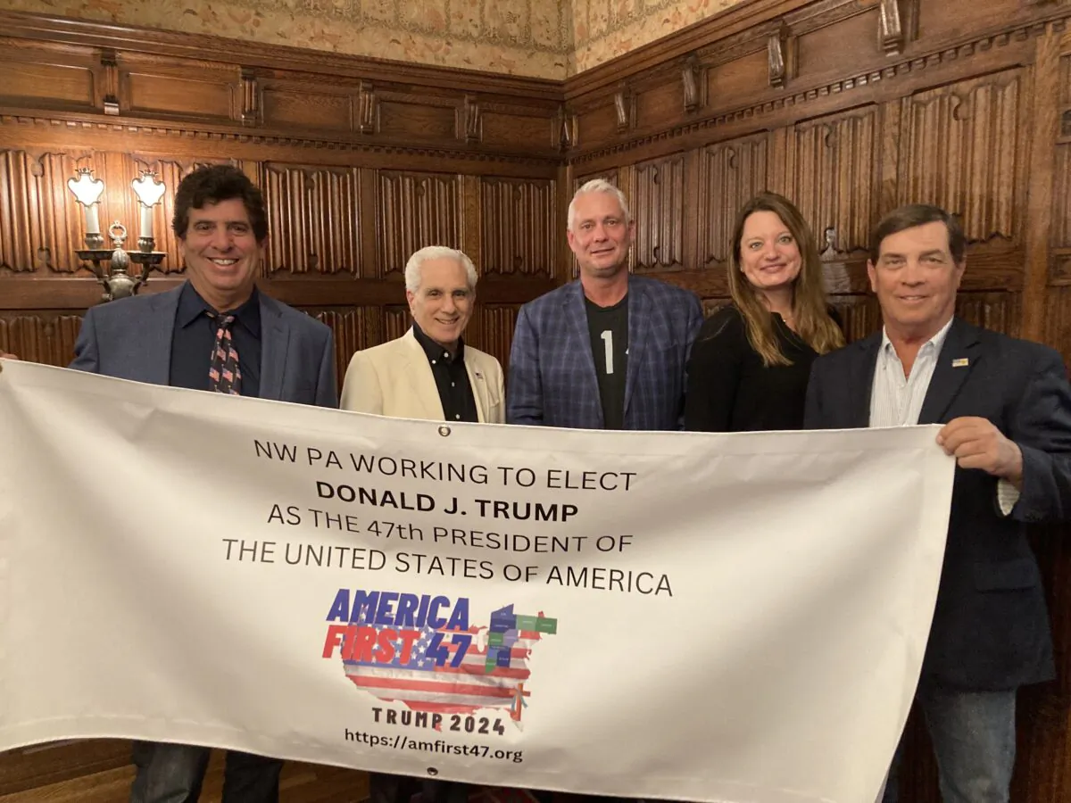 Anthony Ruffa, Louis Aliota, Brad Peganoff, Melanie Brewer, and Greg Hayes gather at an office in Erie, Pa., to work on plans for their new pro-Donald Trump group, AmFirst 47, on May 22, 2023. (Janice Hisle/The Epoch Times)