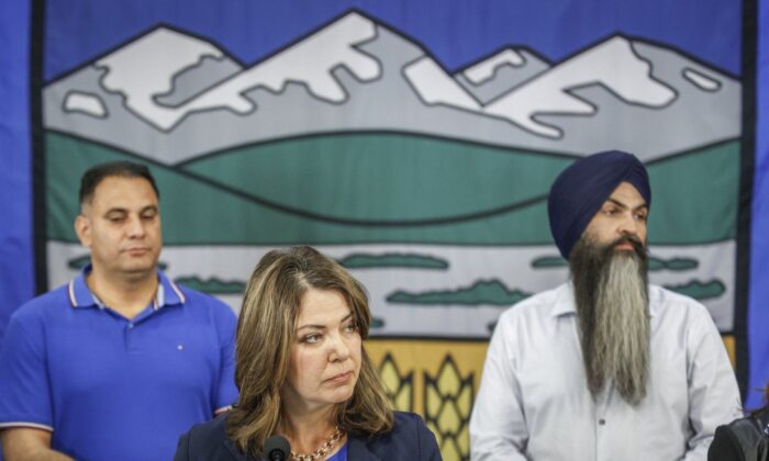 United Conservative Party leader Danielle Smith, centre, makes an election campaign announcement in Calgary, Alta., May 26, 2023. (The Canadian Press/Jeff McIntosh)
