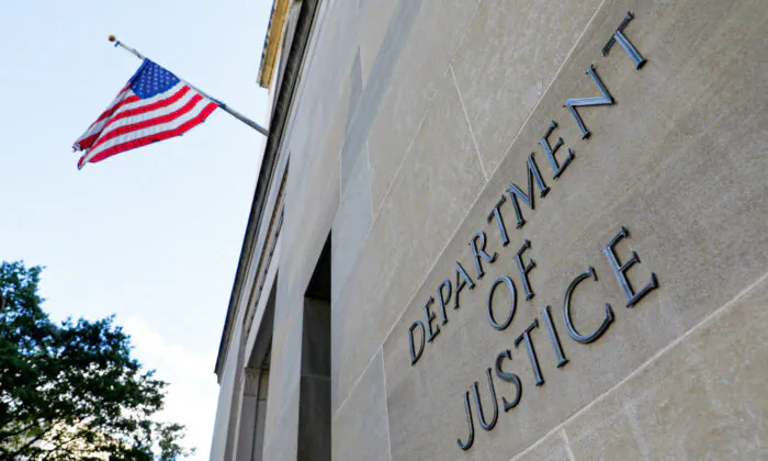 Signage is seen at the United States Department of Justice headquarters in Washington, on Aug. 29, 2020. (Andrew Kelly/Reuters)