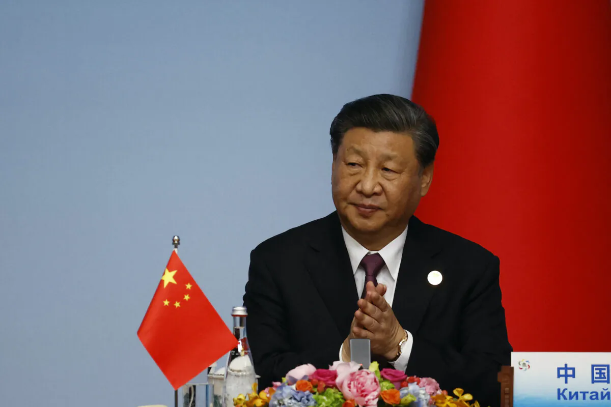Chinese leader Xi Jinping applauds during the joint press conference of the China-Central Asia Summit in Xian, in China's northern Shaanxi province on May 19, 2023. (Florence Lo/POOL/AFP via Getty Images)