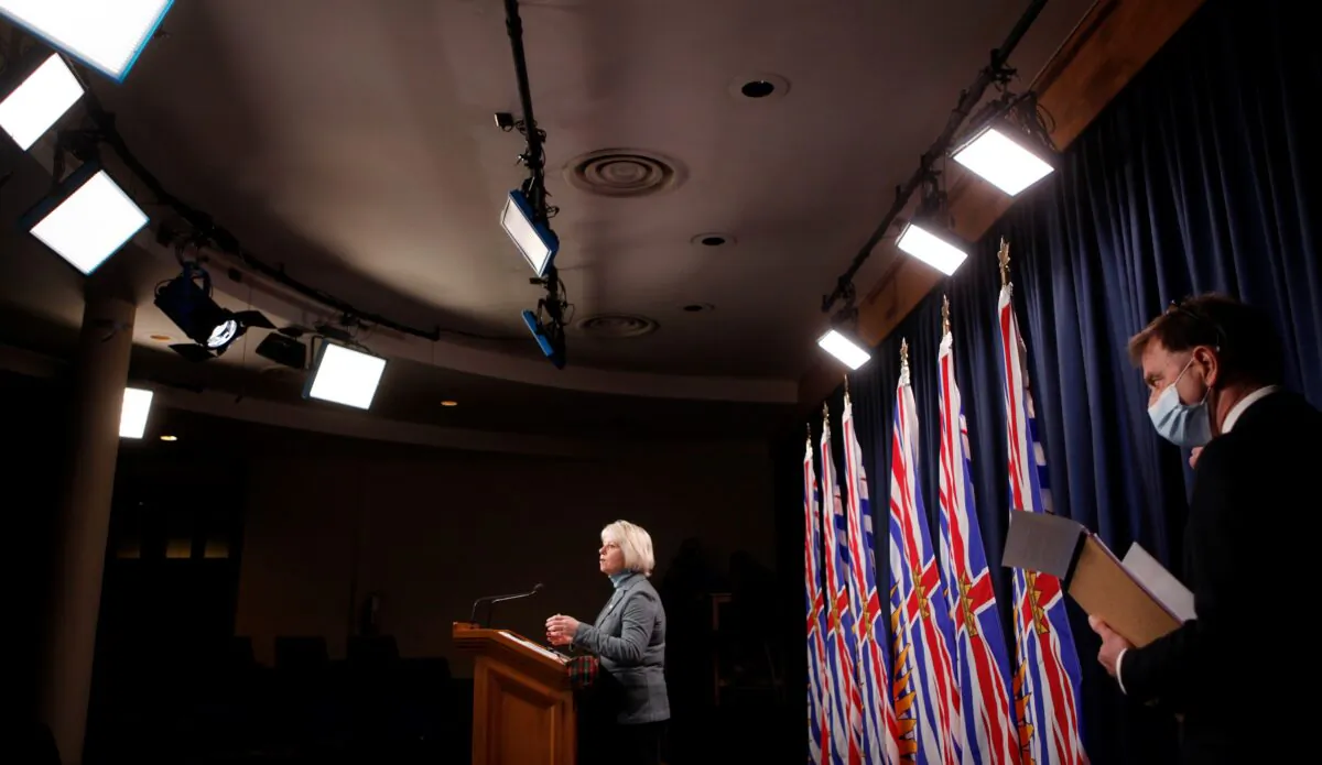 B.C. Provincial Health Officer Dr. Bonnie Henry and Health Minister Adrian Dix hold a press conference in Victoria on Dec. 21, 2021. (The Canadian Press/Chad Hipolito)