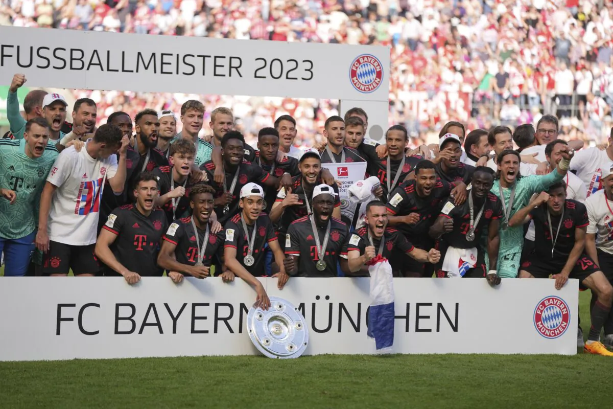 Bayern Munich players celebrate winning the German championship after the German Bundesliga soccer match between 1.FC Cologne and FC Bayern Munich in Cologne, Germany, on May 27, 2023. (Matthias Schrader/AP Photo)