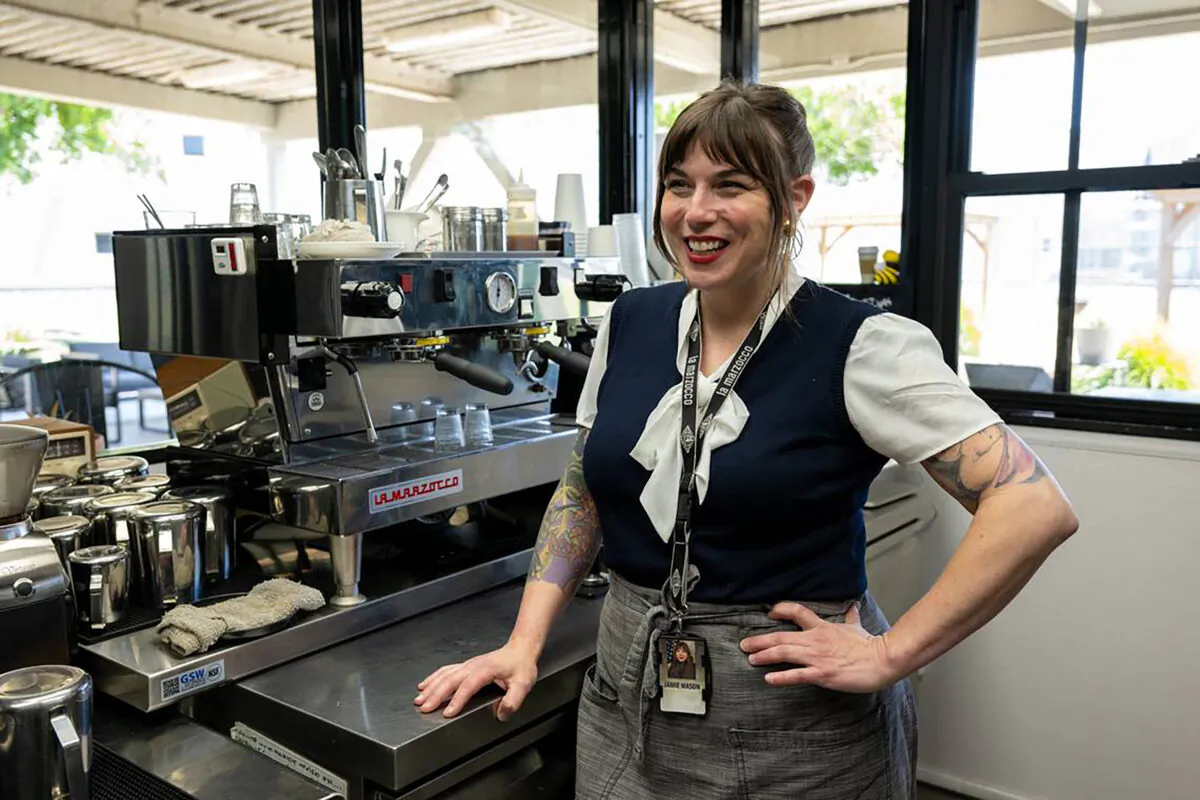 Jamie Mason, who teaches inmates how to be baristas at the Rio Cosumnes Correctional Center near Elk Grove, stands with a La Marzocco espresso machine at Redemption Coffee, the jail's internal cafe and training center, on Wednesday. (Paul Kitagaki Jr./The Sacramento Bee/TNS)