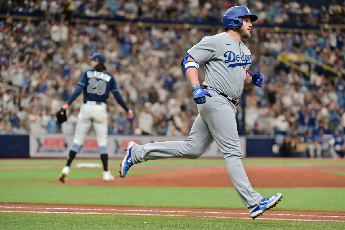 Max Muncy (13) of the Los Angeles Dodgers runs the bases after hitting a home run off of Tyler Glasnow (20) of the Tampa Bay Rays in the second inning at Tropicana Field in St. Petersburg, Fla., on May 26, 2023. (Julio Aguilar/Getty Images)