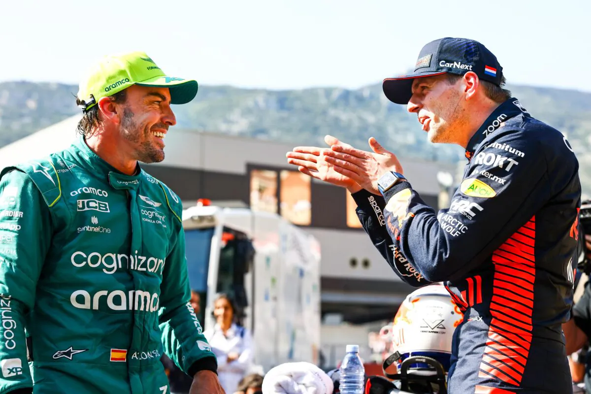Pole position qualifier Max Verstappen of the Netherlands and Oracle Red Bull Racing and Second placed qualifier Fernando Alonso (L) of Spain and Aston Martin F1 Team talk in parc ferme during qualifying ahead of the F1 Grand Prix of Monaco at Circuit de Monaco in Monte-Carlo, Monaco,  on May 27, 2023. (Mark Thompson/Getty Images)