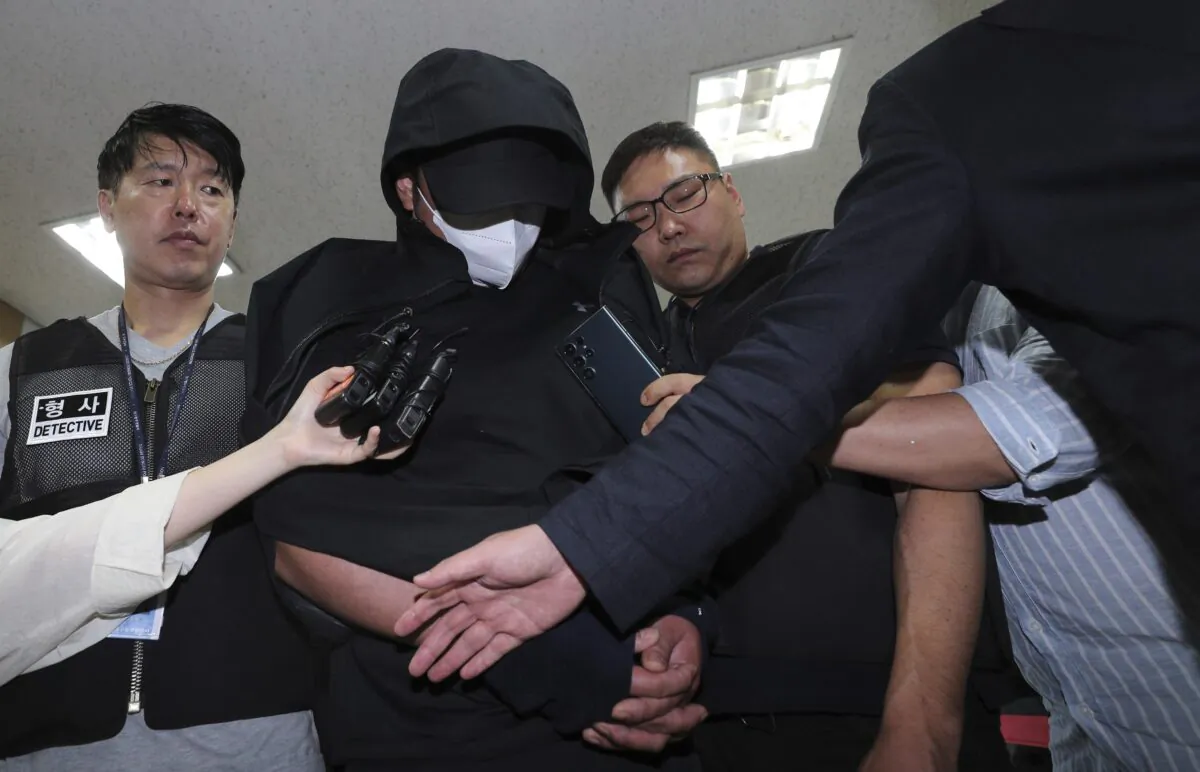 A man who opened an emergency exit door during a flight, arrives to attend an arrest warrant review at the Daegu District Court in Daegu, South Korea, on May 28, 2023. (Yun Kwan-shick/Yonhap via AP)
