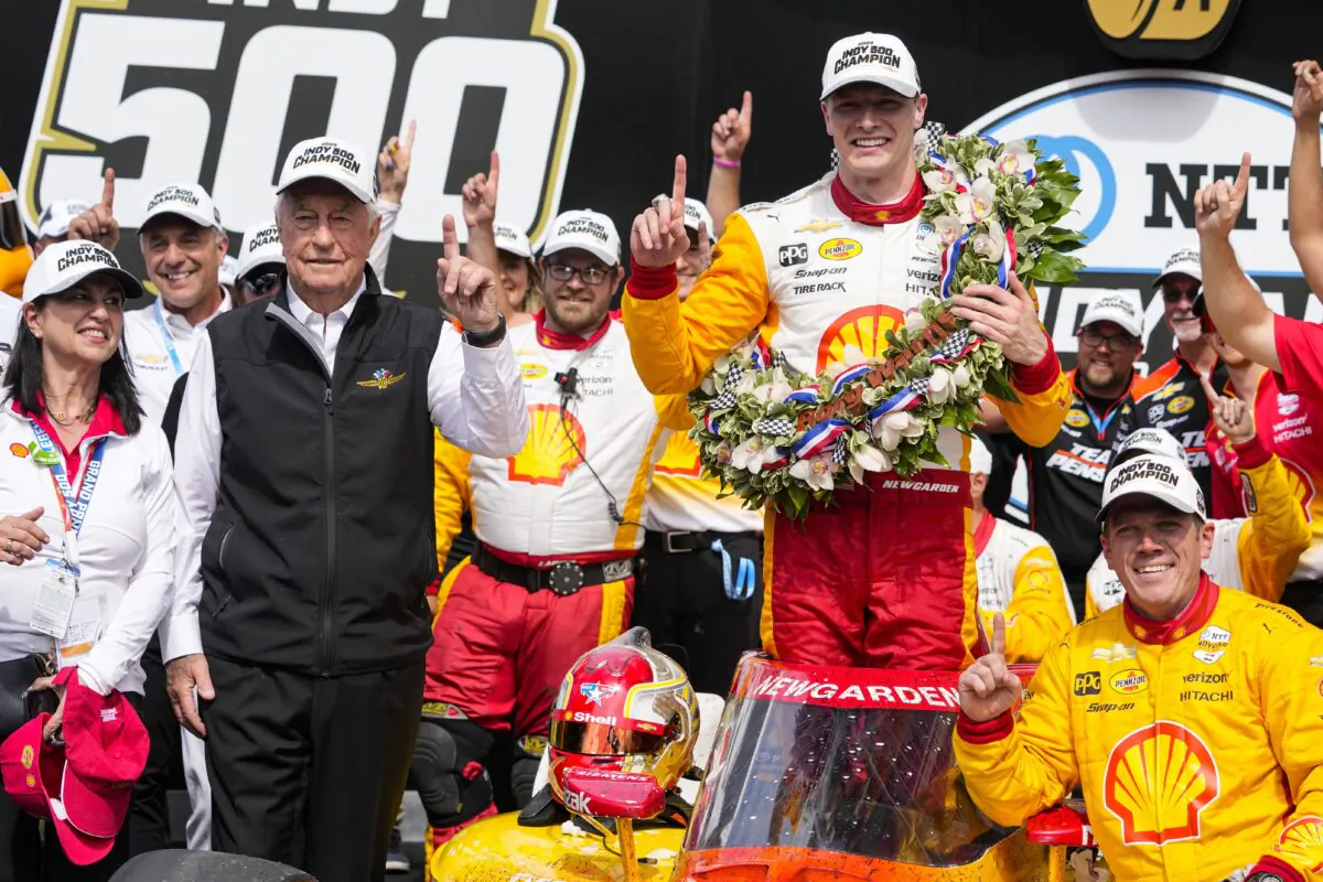 Josef Newgarden celebrates with his team and car owner Roger Penske (L) after winning the Indianapolis 500 auto race at Indianapolis Motor Speedway in Indianapolis on May 28, 2023. (Michael Conroy/AP Photo)