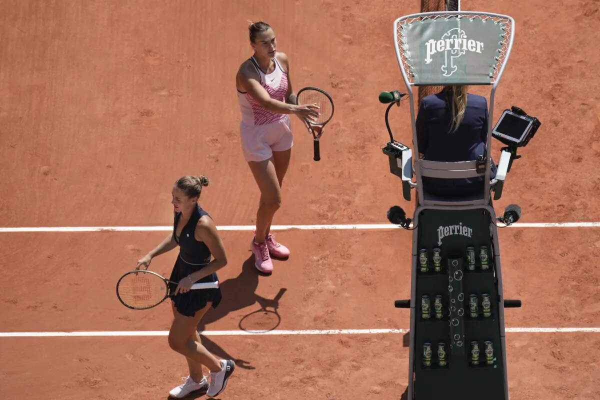 Aryna Sabalenka of Belarus (top) and Ukraine's Marta Kostyuk (L) refuses to shake hands at the end of their first round match of the French Open tennis tournament at the Roland Garros stadium in Paris on May 28, 2023. (Christophe Ena/AP Photo)