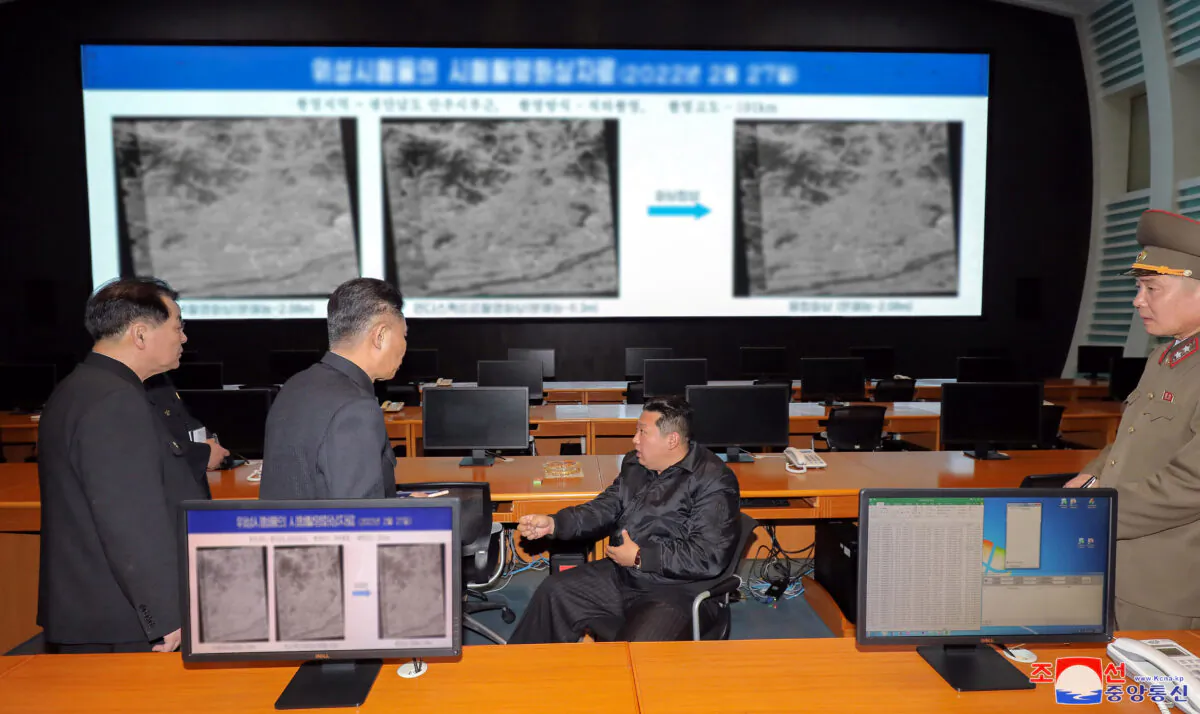 North Korean leader Kim Jong Un inspects North Korea's National Aerospace Development Administration after recent satellite system tests, in Pyongyang, North Korea, in this photo released by state media on March 10, 2022. (KCNA via Reuters)