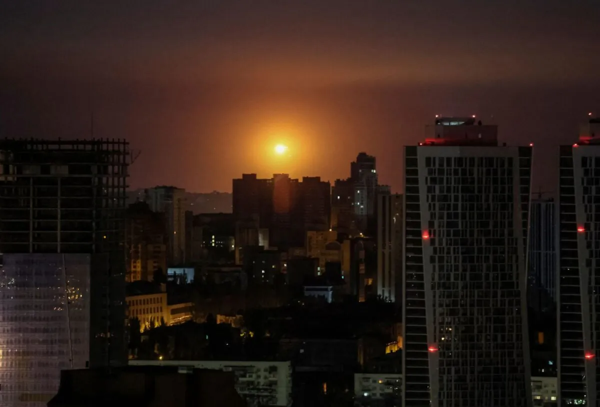 An explosion is seen in the sky over the city during a Russian drone and missile strike in Kyiv, Ukraine, on May 29, 2023. (Gleb Garanich/Reuters)
