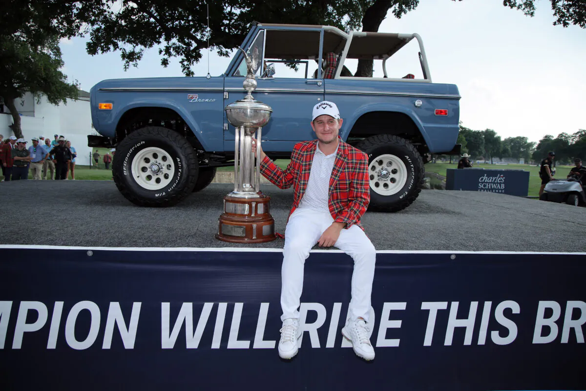 Emiliano Grillo of Argentina poses with the trophy and the winners jacket in front of a Ford Bronco after winning the Charles Schwab Challenge in a playoff at Colonial Country Club in Fort Worth, Texas, on May 28, 2023. (Jonathan Bachman/Getty Images)