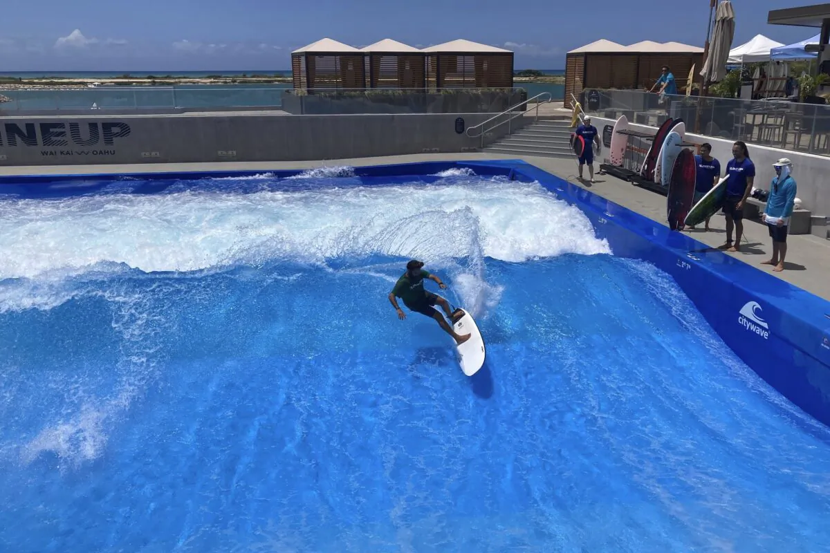 Ikaika Kaulukukui surfs in a wave pool in Ewa Beach, Hawaii, on May 9, 2023. (Jennifer Sinco Kelleher/AP Photo)