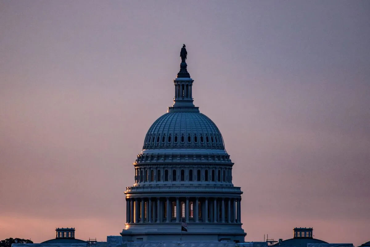 The US Capitol building seen from the base of the Washington Monument as the sun rises in Washington on May 28, 2023. (Samuel Corum/AFP via Getty Images)