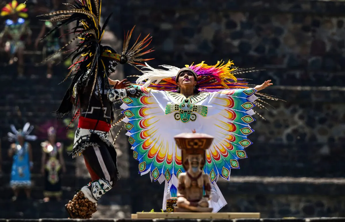 Performers in an Aztec dance at the archaeological site of Teotihuacan, Mexico, on July 2, 2019. (Ronaldo Schemidt/AFP via Getty Images)