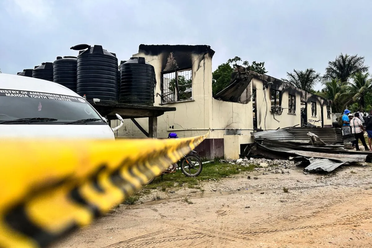 The school dormitory that caught fire and left at least 19 people dead in Mahdia, Guyana, on May 22, 2023. (Keno George/AFP via Getty Images)