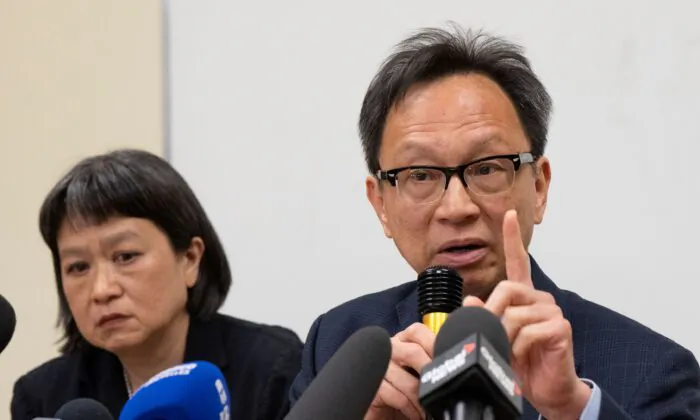 Sen. Yuen Pau Woo (R) denounces RCMP allegations of Beijing interference in Canada during a news conference in Montreal on May 5, 2023. (The Canadian Press/Ryan Remiorz)