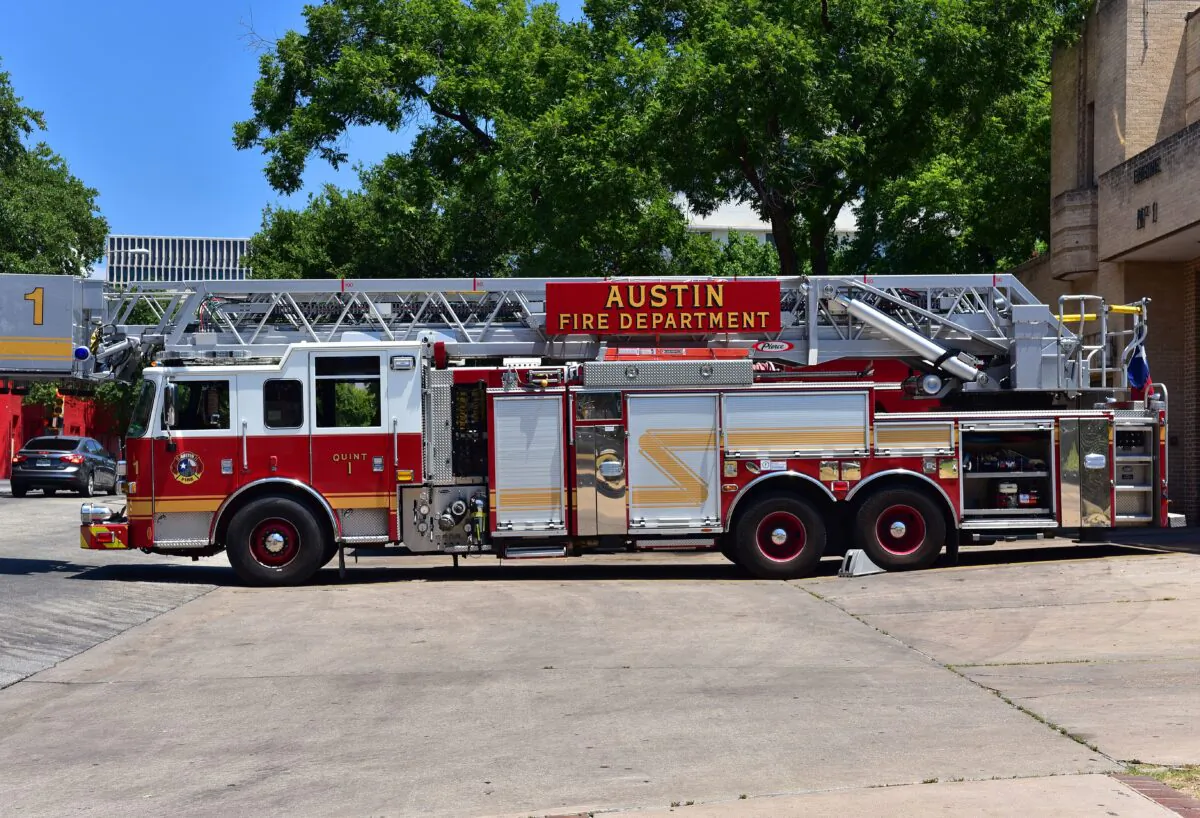 A firetruck in the driveway in front of the Austin Fire Department station in Austin, Texas, in August 2015. (Tomasz Kubis/Shutterstock)