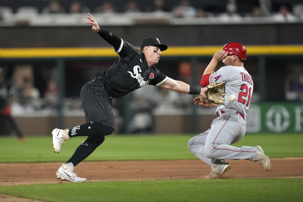 Los Angeles Angels' Matt Thaiss (21) steals second as the throw from Chicago White Sox catcher Yasmani Grandal pulls Romy Gonzalez, left, away from the bag during the eighth inning of a baseball game in Chicago on May 29, 2023. (Charles Rex Arbogast/AP Photo)