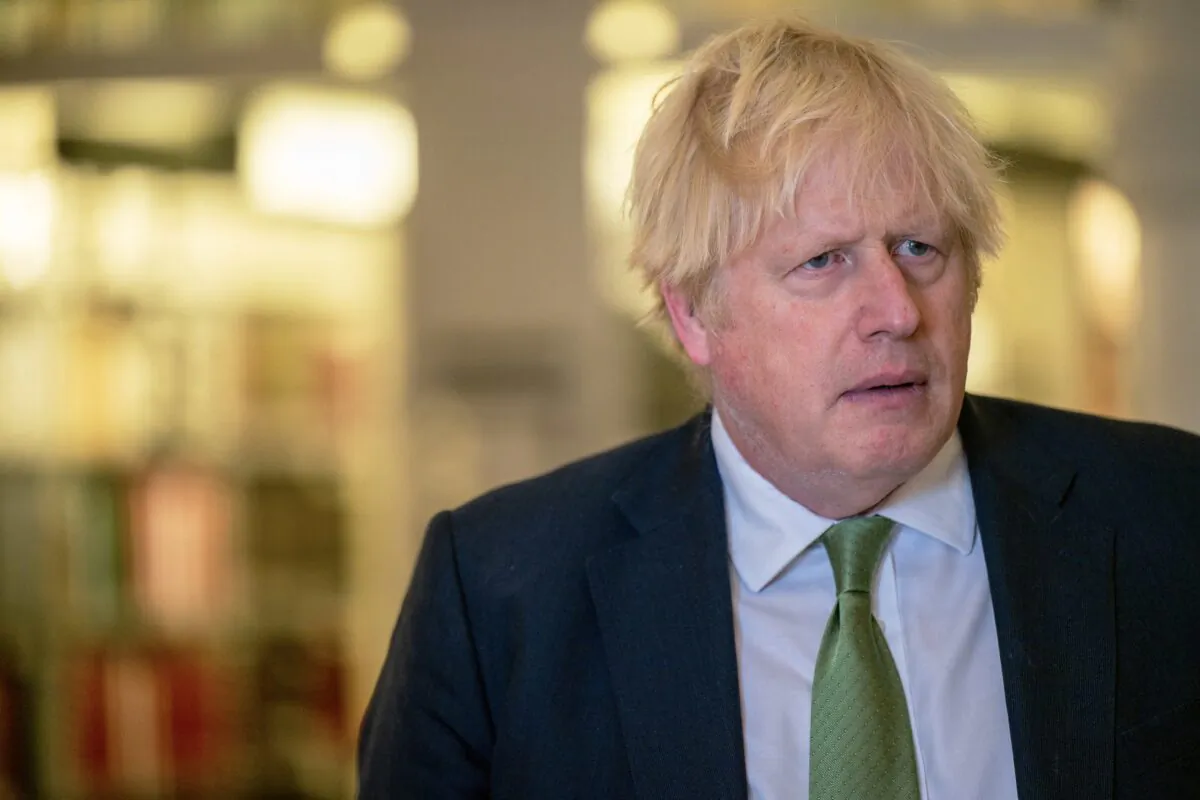Former UK Prime Minister Boris Johnson listens during a tour after a meeting with Gov. Greg Abbott at the Texas State Capitol in Austin, Texas, on May 23, 2023. (Brandon Bell/Getty Images)