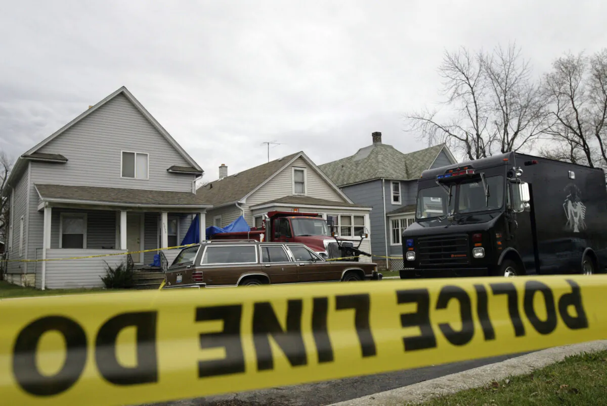 A home on Ash Avenue where police found at least two bodies buried in the basement in Hammond, Ind., on Dec. 10, 2003. (Tasos Katopodis/Getty Images)