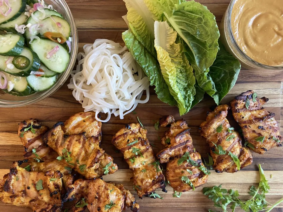Serve the spicy grilled chicken with a curried peanut sauce. (JeanMarie Brownson/TNS)