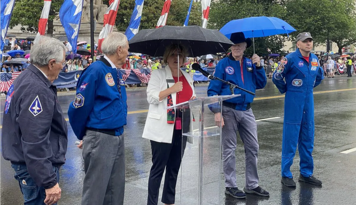 Veteran astronauts of the Apollo Program, joined by Artemis II's Randy Bresnik, are introduced at the National Memorial Day Parade on May 29, 2023. (Joseph Lord/The Epoch Times)