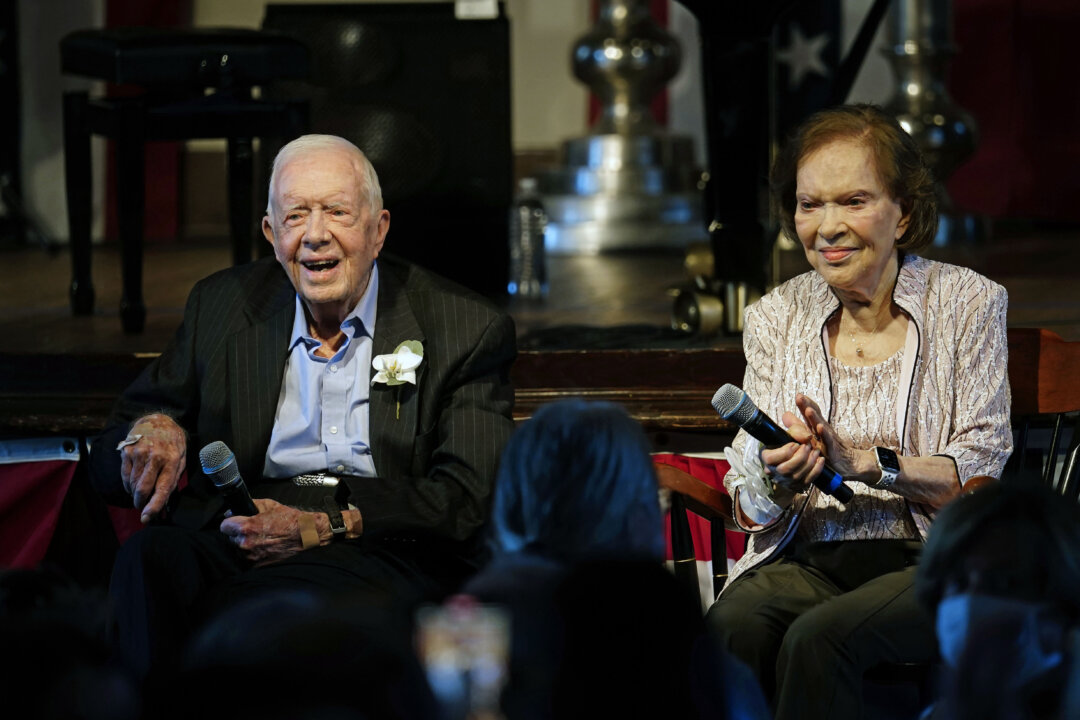 Former President Jimmy Carter and his wife, former first lady Rosalynn Carter, sit together during a reception to celebrate their 75th wedding anniversary in Plains, Georgia, on July 10, 2021. (John Bazemore/AP Photo/Pool/File)