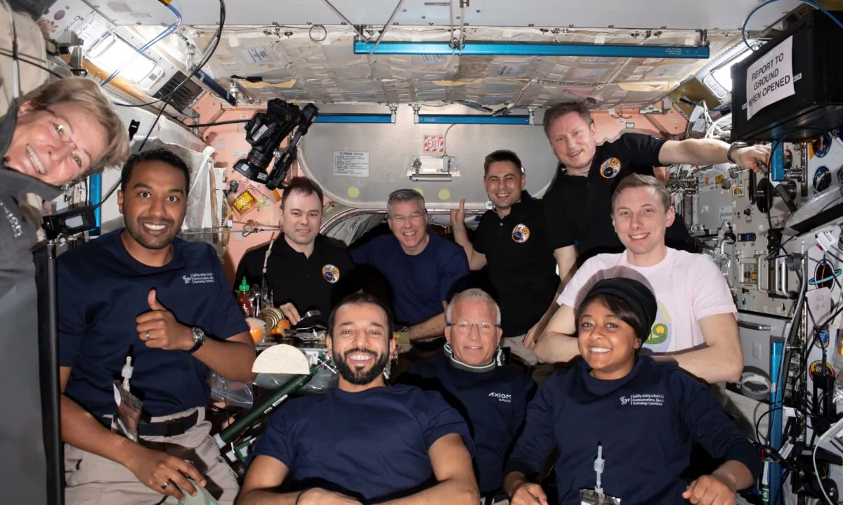 Axiom Mission-2 and Expedition 69 crew members gather for a portrait together during dinner time aboard the International Space Station on May 23, 2023. (NASA via AP)