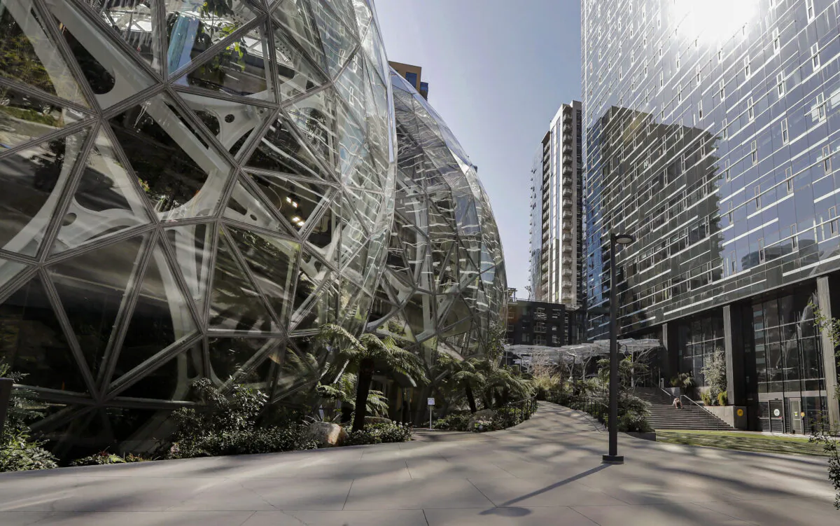 Employees walk through a lobby at Amazon's headquarters in Seattle on Nov. 13, 2018. (Elaine Thompson/AP Photo)