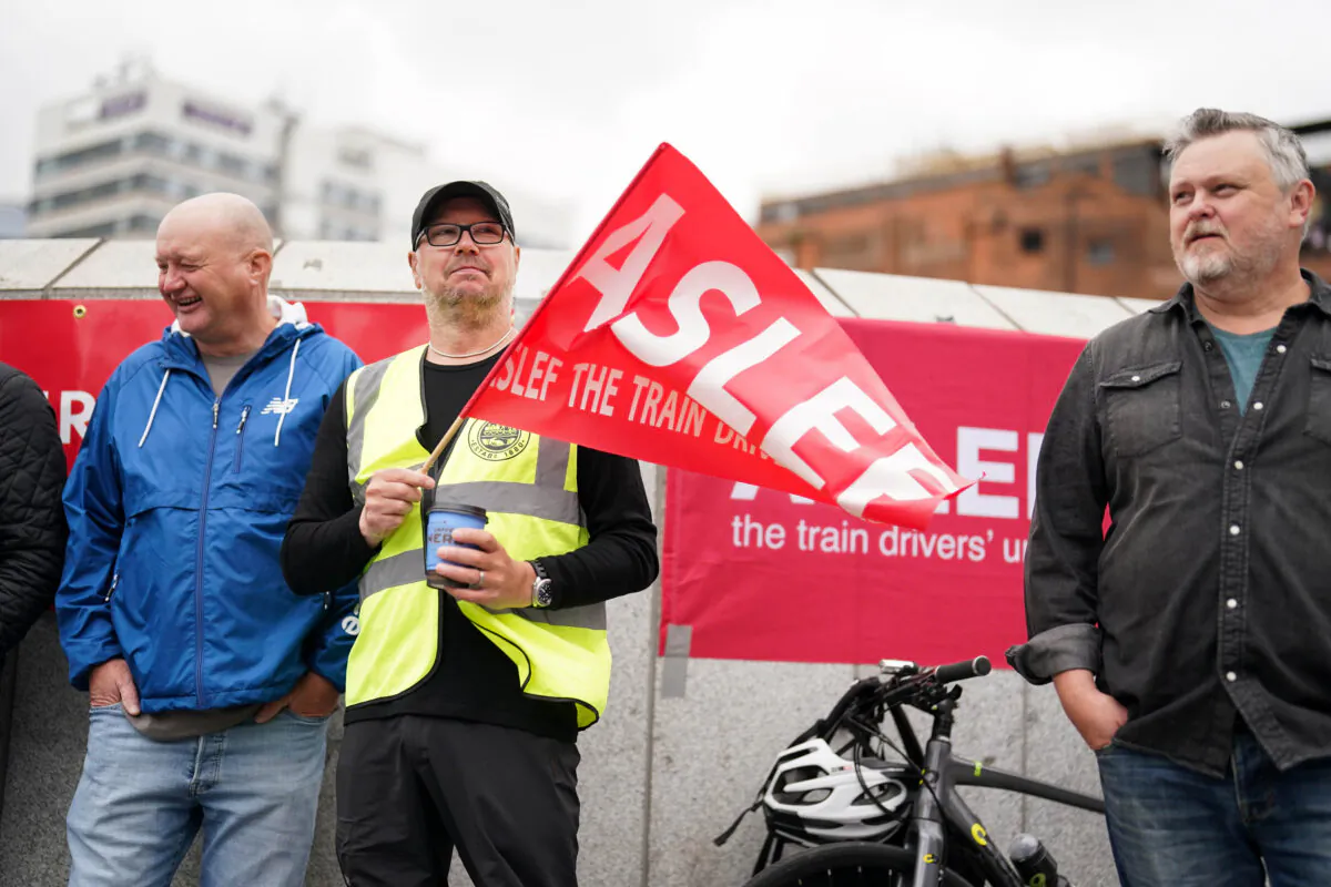Members of the drivers' union Aslef on the picket line at New Street station in Birmingham, England, on May 31, 2023. (Jacob King/PA Media)