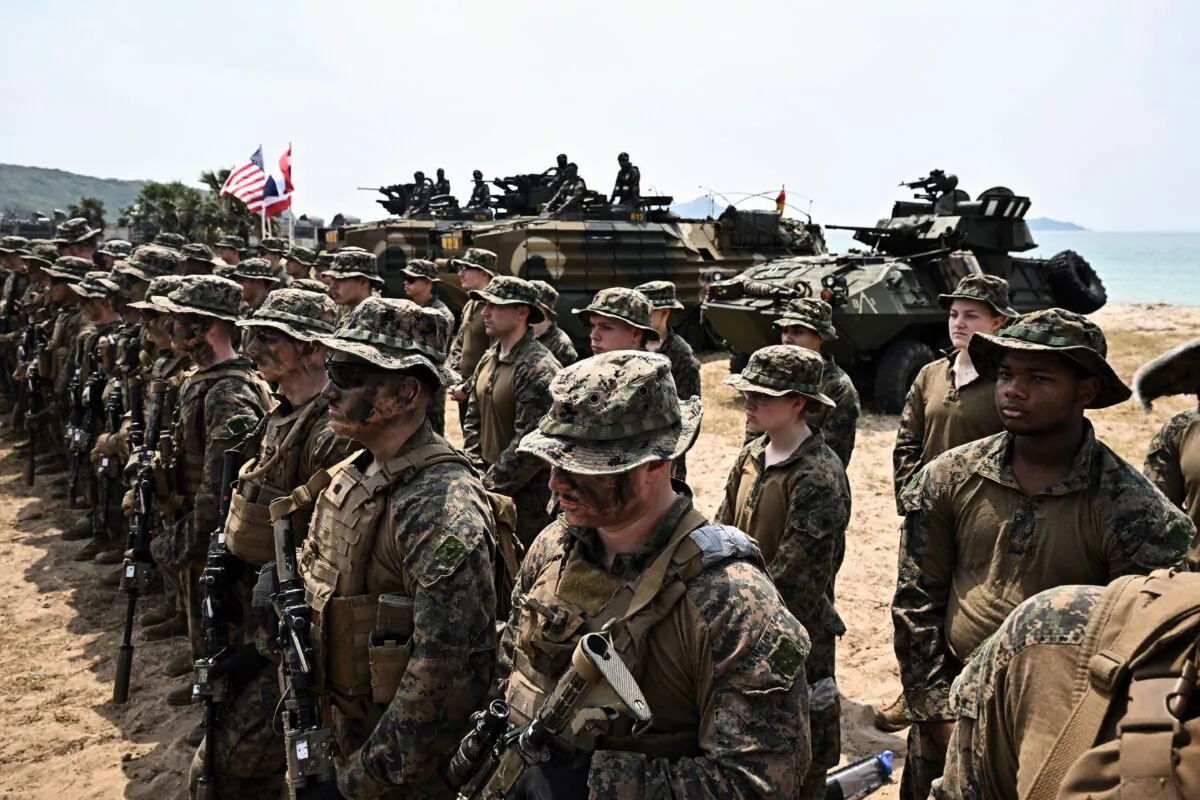Ron DeSantis wants the U.S. military to get refocused on fighting external wars, rather than the culture wars fought as the Biden administration has sought to institute pronoun and transgender policies. Here, U.S. Marines line up in an exercise in Thailand on March 3, 2023. (Lillian Suwanrumpha/AFP via Getty Images)