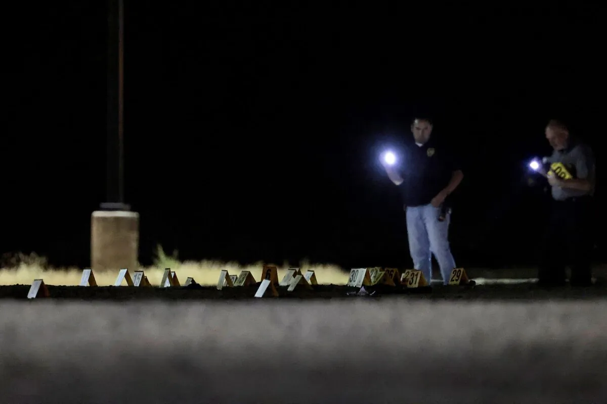 Law enforcement investigate a shooting scene in parking lot A of Subaru Park in Chester, Pa., on May 28, 2023. (Elizabeth Robertson/The Philadelphia Inquirer via AP)