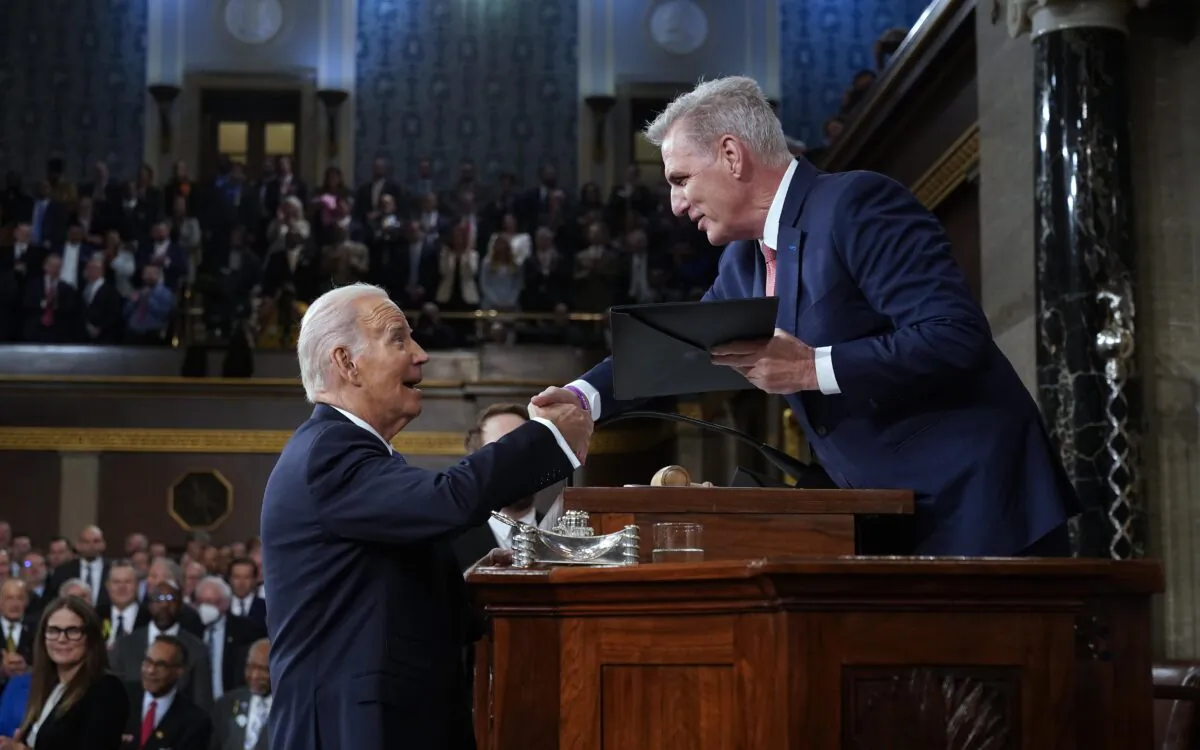 President Joe Biden shakes hands with House Speaker Kevin McCarthy (R-Calif.) before his State of the Union address in February at the U.S. Capitol in Washington, on Feb. 7, 2023. (Jacquelyn Martin/Pool/Getty Images)