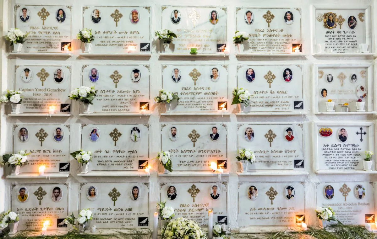 Candles are lit on a memorial wall during an anniversary memorial service at the Holy Trinity Cathedral in Addis Ababa, Ethiopia, on March 8, 2020, to remember those who died when Ethiopian Airlines flight ET302, a Boeing 737 Max, crashed shortly after takeoff on March 10, 2019, killing all 157 on board. (Mulugeta Ayene/AP Photo)