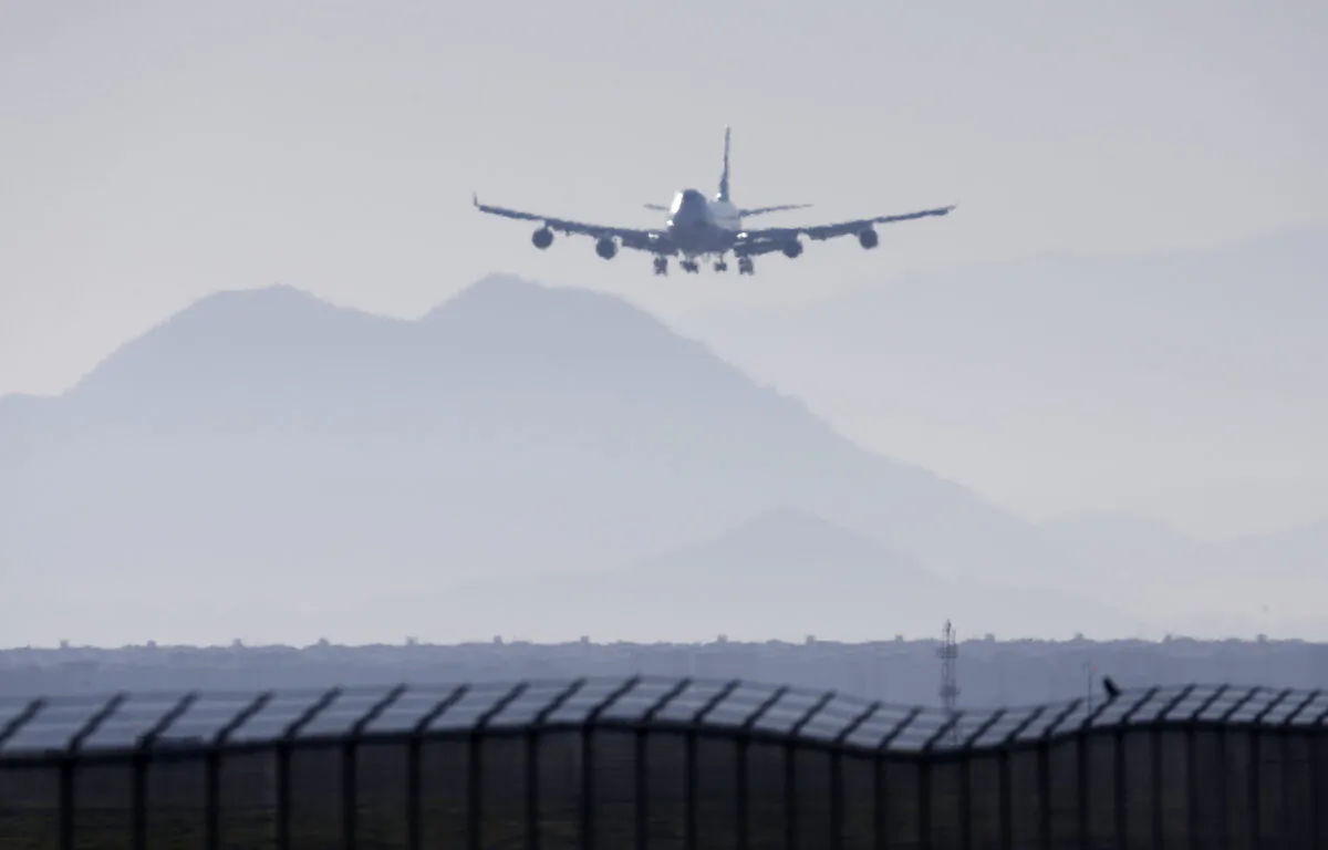 An airplane prepares to land at March Air Reserve Base in Riverside, Calif., on Jan. 29, 2020. (Ringo H.W. Chiu/AP Photo)