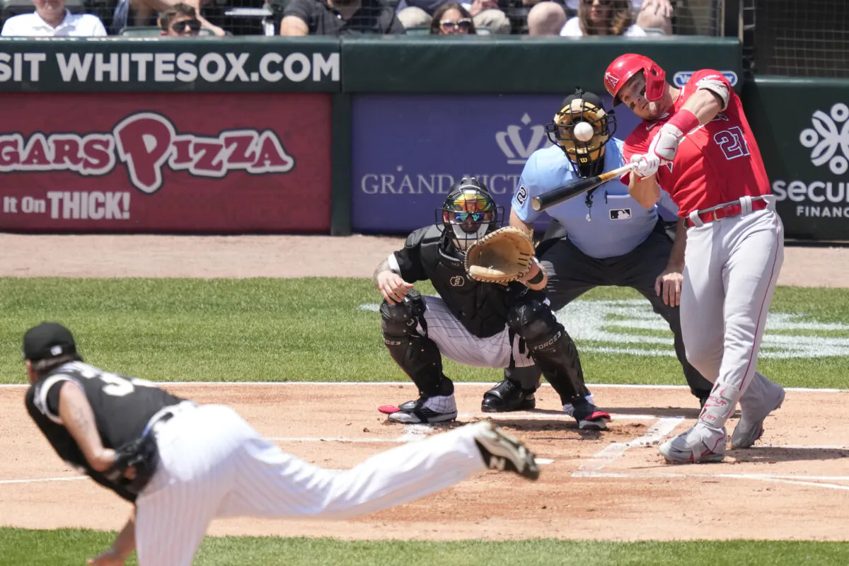 Los Angeles Angels' Mike Trout hits a two-run home run off Chicago White Sox starting pitcher Lance Lynn, as catcher Yasmani Grandal and home plate umpire James Hoye watch during the first inning of a baseball game in Chicago on May 31, 2023. (Charles Rex Arbogast/AP Photo)