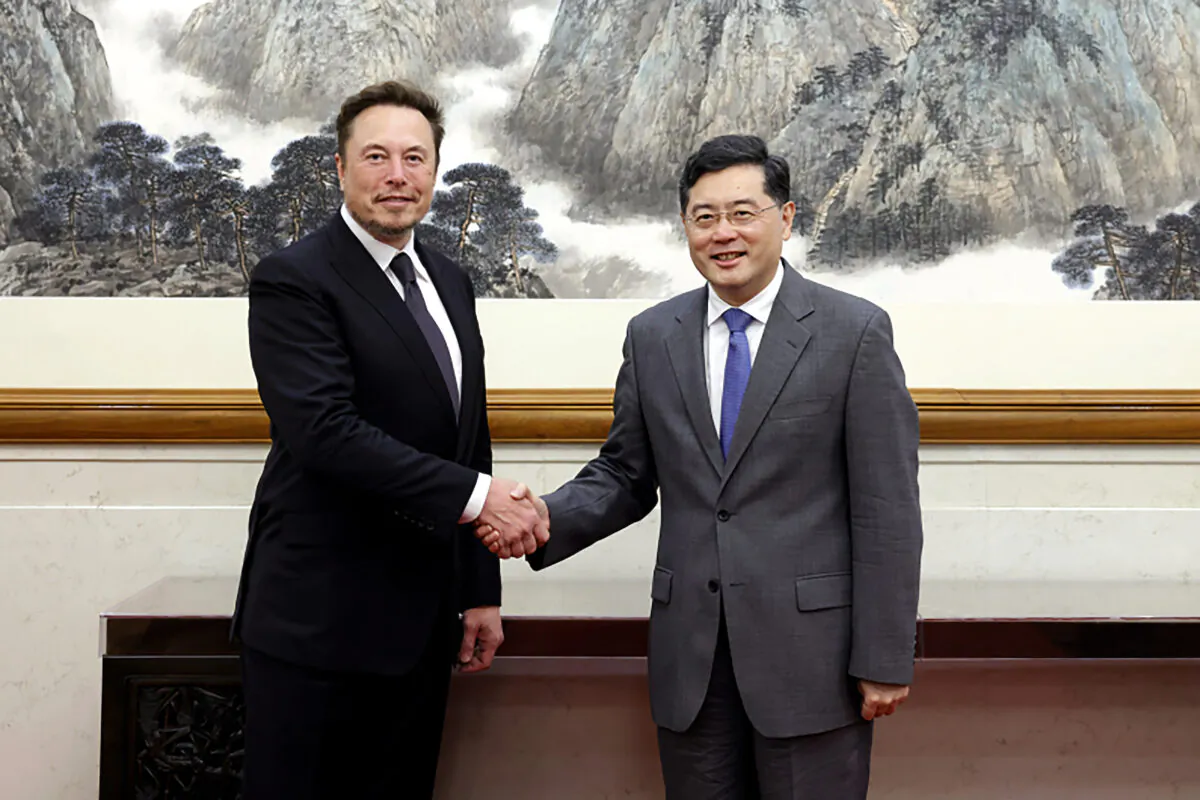 China's Foreign Minister Qin Gang poses for photos with Tesla CEO Elon Musk in Beijing on May 30 2023. (China's Ministry of Foreign Affairs via AP)