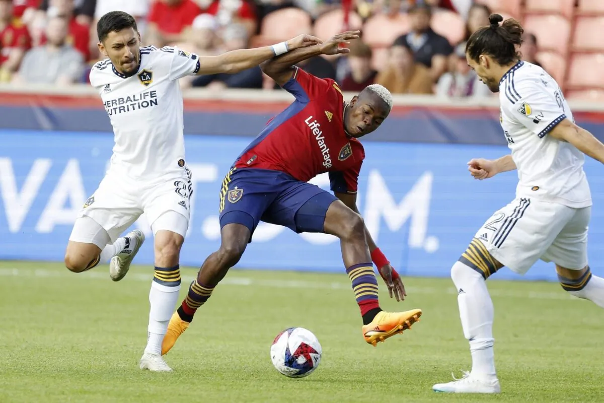 Los Angeles Galaxy midfielder Marco Delgado (8) and Real Salt Lake forward Carlos Andres Gomez (11) battle in the first half at America First Field Sandy, Utah, on May 31, 2023. (Jeff Swinger/USA TODAY Sports via Field Level Media)