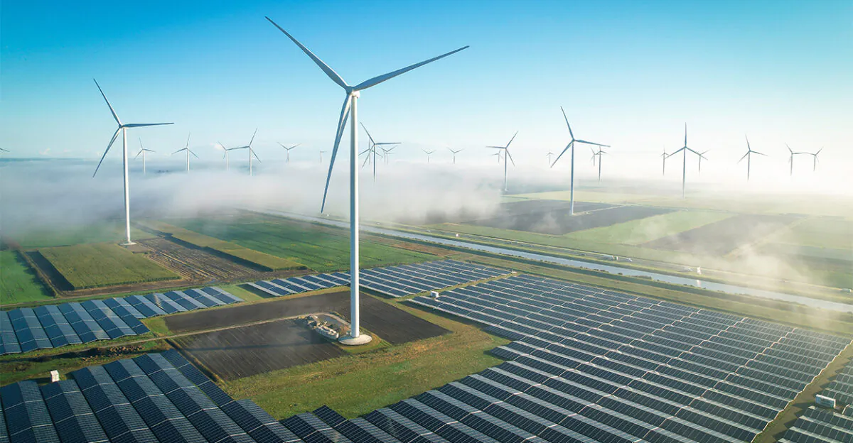 Solar energy fields and wind turbines seen from the air in foggy conditions in Muntendam, Netherlands, in September 2022. (Daniel Bosma/Getty Images)