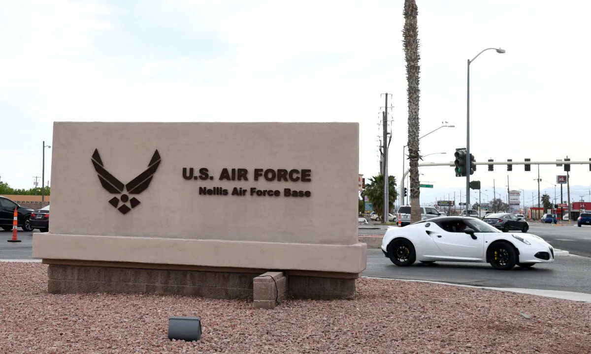 A sign near the main gate of Nellis Air Force Base in Las Vegas on April 3, 2020. (Ethan Miller/Getty Images)