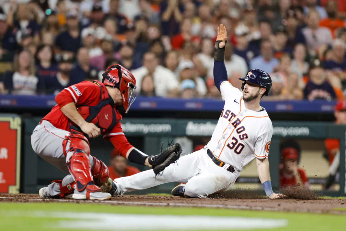 Kyle Tucker (30) of the Houston Astros beats the tag from Matt Thaiss (21) of the Los Angeles Angels to score during the second inning at Minute Maid Park in Houston on June 1, 2023. (Carmen Mandato/Getty Images)