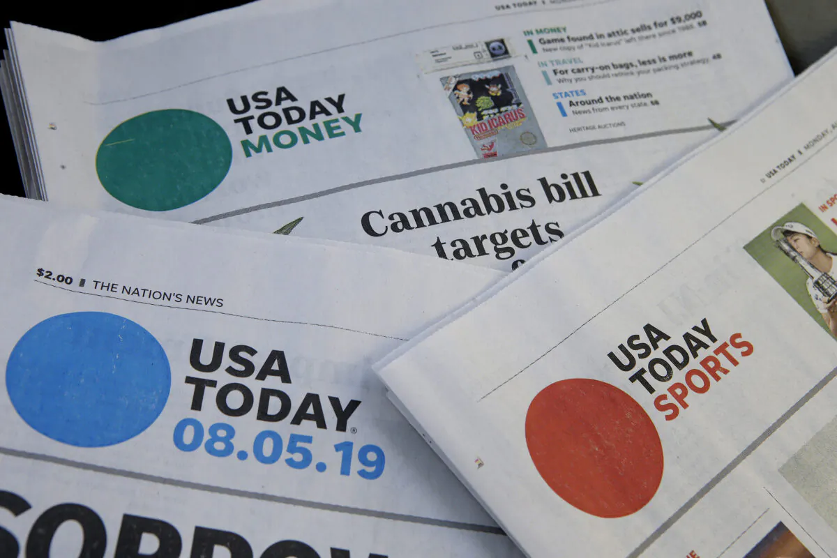 Sections of a USA Today newspaper in Norwood, Mass., on Aug. 5, 2019. (Steven Senne/AP Photo)