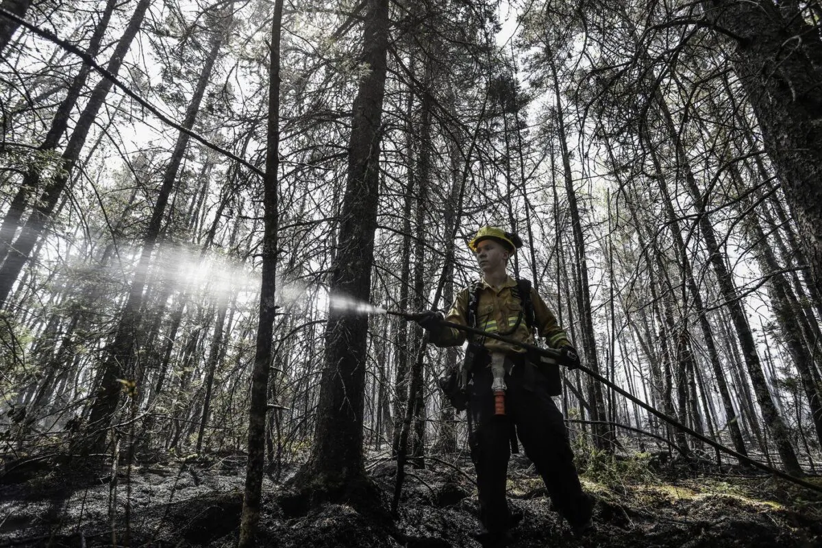 Department of Natural Resources and Renewables firefighter Kalen MacMullin of Sydney, N.S., works on a fire in Shelburne County, N.S., in a June 1, 2023 handout photo. (The Canadian Press/HO-Communications Nova Scotia)
