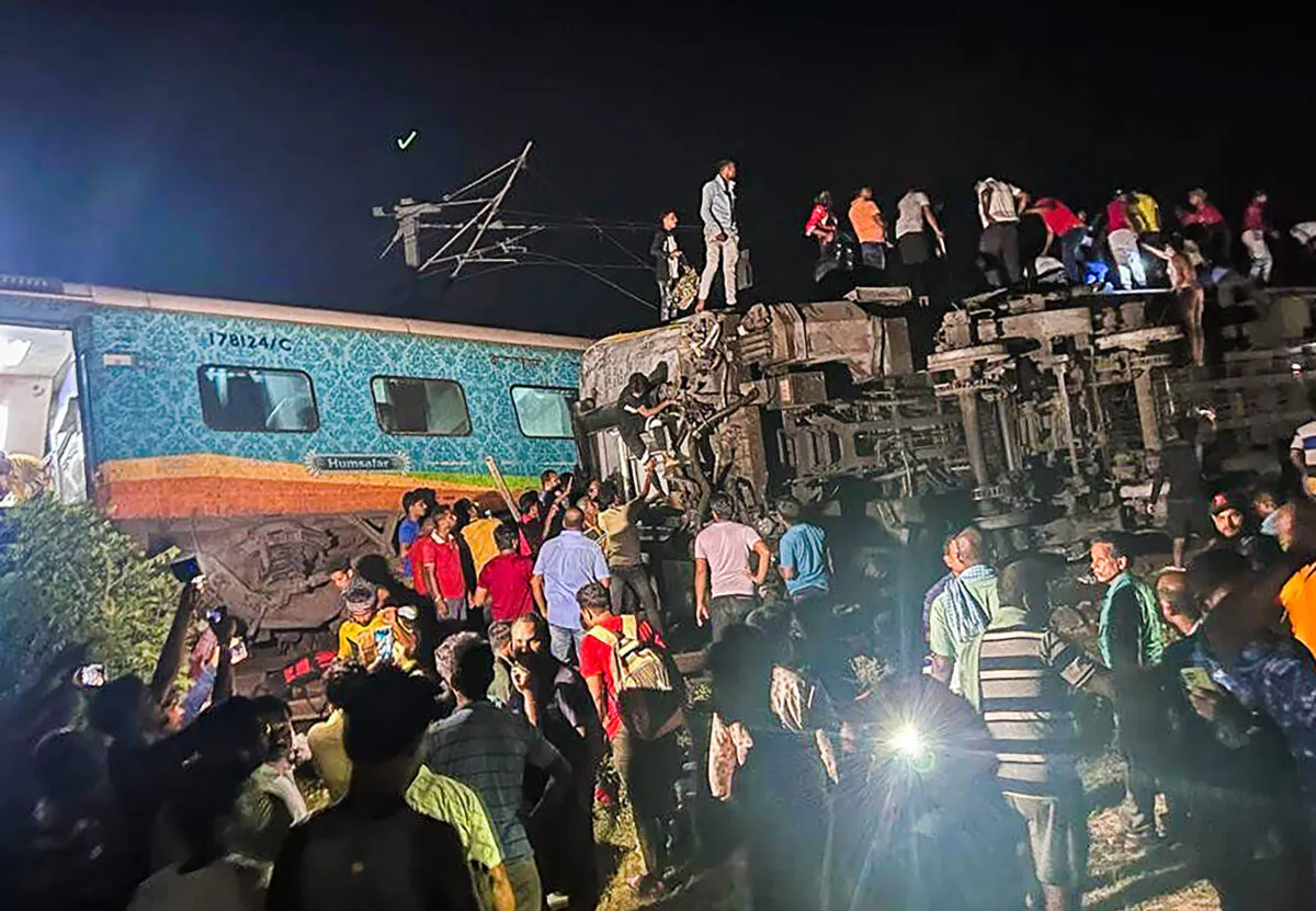 Rescuers work at the site of passenger trains that derailed in Balasore district, in the eastern Indian state of Orissa on June 2, 2023. (Press Trust of India via AP)